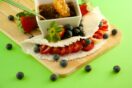 Tapioca wrap with strawberries, blueberries, and honeycomb makes a vibrant snack.